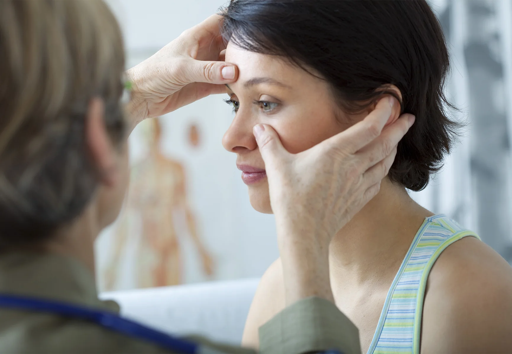 ENT doctor assessing patient's sinuses