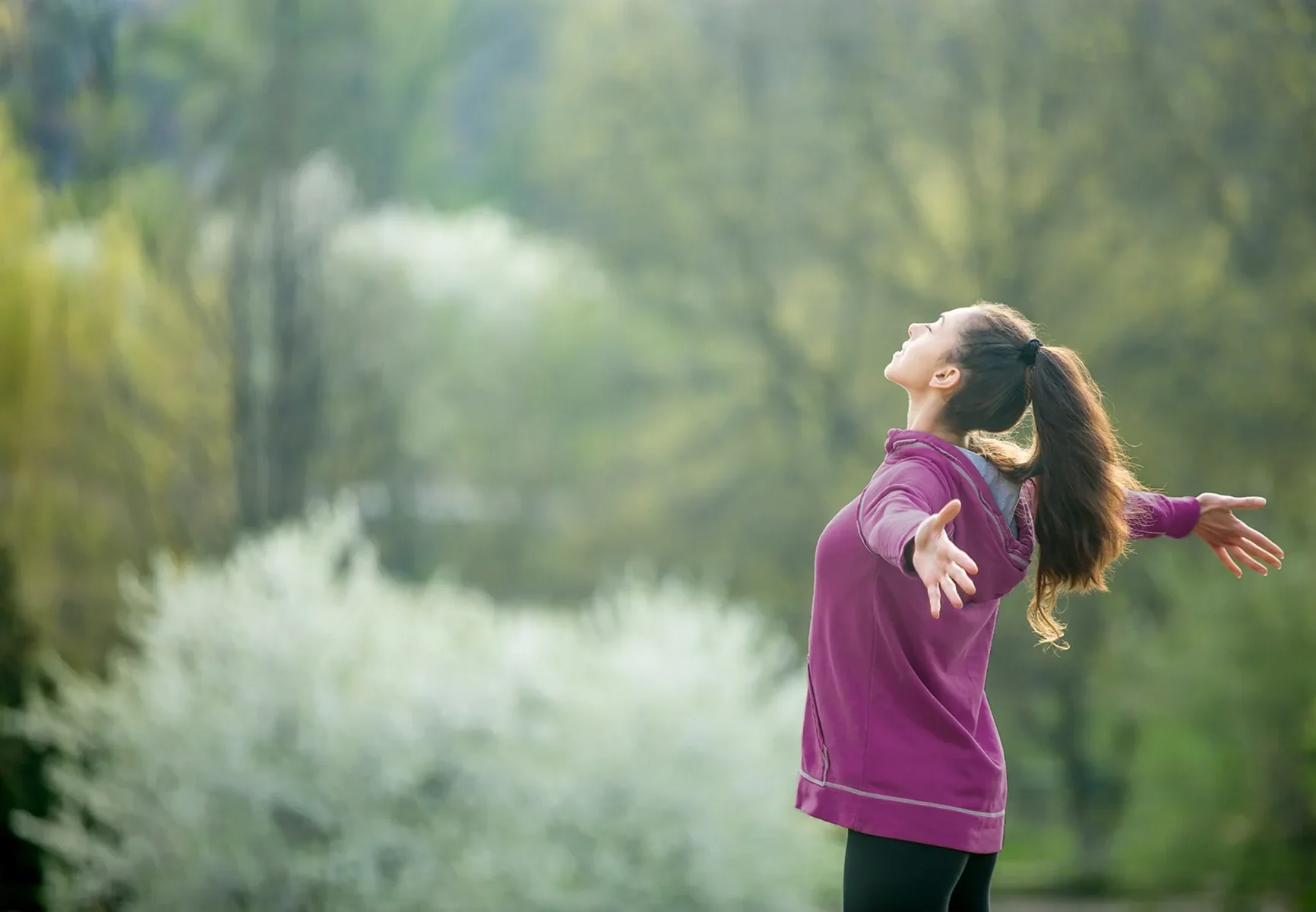 Woman in nature breathing fresh air