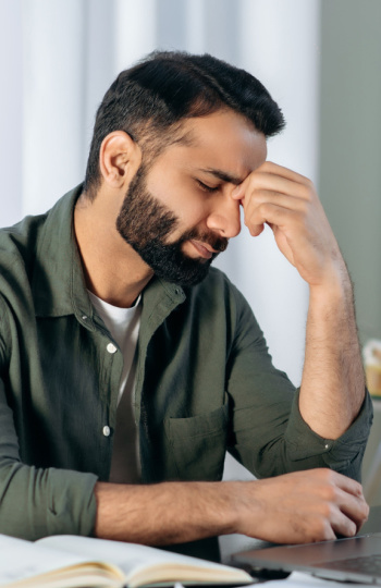 man at with with a sinus headache